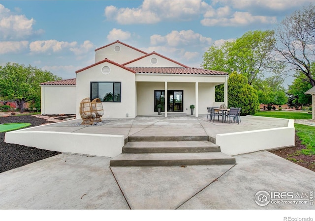 5304 Vardon Way, Fort Collins, CO 80528 - rear view of house featuring a tile roof, a patio area, and stucco siding