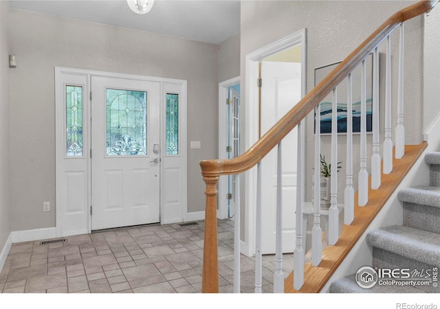 1369 Padfield Pl, Erie, CO 80516 - entrance foyer featuring stairs and baseboards