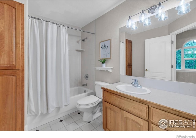 1369 Padfield Pl, Erie, CO 80516 - bathroom with tile patterned floors, shower / bath combo with shower curtain, toilet, and vanity