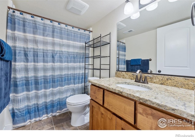 1458 S Dusk Dr, Milliken, CO 80543 - bathroom featuring toilet, vanity, and a shower with curtain