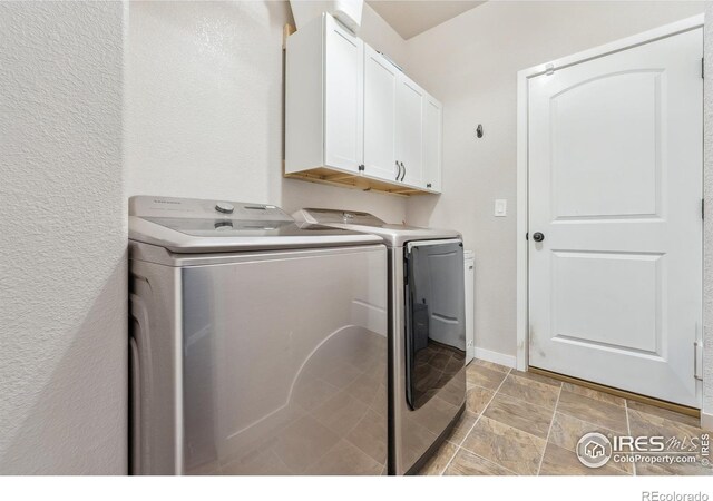 1458 S Dusk Dr, Milliken, CO 80543 - washroom with cabinet space and washing machine and clothes dryer
