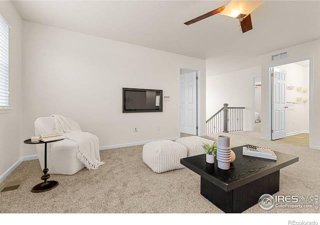 687 Jarvis Dr, Erie, CO 80516 - living area featuring carpet, ceiling fan, and baseboards