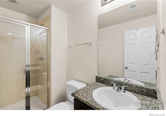 687 Jarvis Dr, Erie, CO 80516 - full bathroom with a stall shower, vanity, and toilet