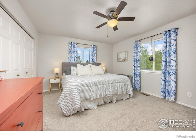 bedroom with carpet, baseboards, and ceiling fan