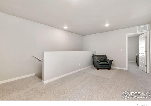 602 Santa Fe Trl Unit D1, Ault, CO 80610 - unfurnished room featuring an upstairs landing, carpet flooring, baseboards, and recessed lighting