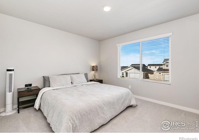 602 Santa Fe Trl Unit D1, Ault, CO 80610 - bedroom featuring baseboards and carpet