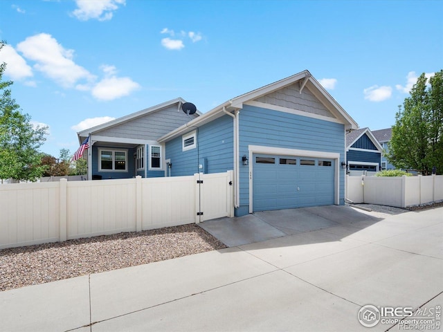 569 Jackson St, Lafayette, CO 80026 - view of property exterior with a gate, driveway, and an attached garage
