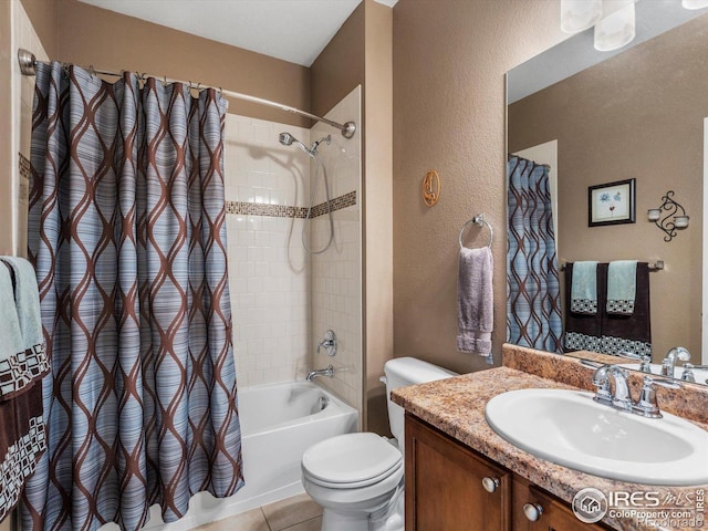569 Jackson St, Lafayette, CO 80026 - full bathroom featuring shower / tub combo, toilet, vanity, a textured wall, and tile patterned flooring