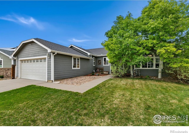 view of front of home featuring a garage, a front yard, driveway, and a shingled roof