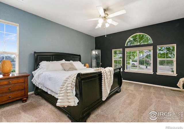 bedroom with carpet flooring, baseboards, and ceiling fan