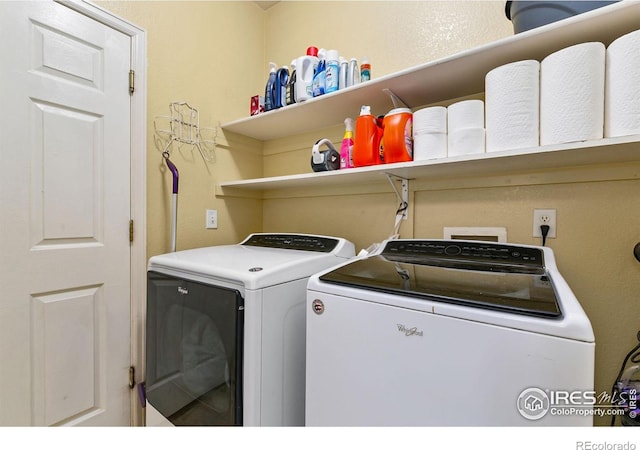 laundry room with separate washer and dryer