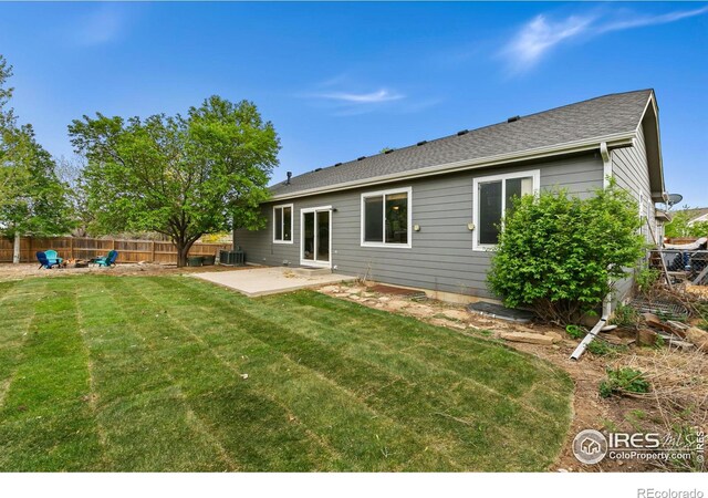 rear view of property with a patio area and cooling unit