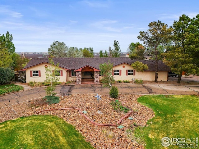 14531 Country Hills Dr, Brighton, CO 80601 - ranch-style home featuring a front lawn and driveway