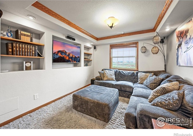 14531 Country Hills Dr, Brighton, CO 80601 - carpeted living room with a textured ceiling, crown molding, built in features, baseboards, and a tray ceiling