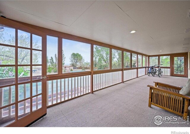 14531 Country Hills Dr, Brighton, CO 80601 - unfurnished sunroom featuring carpet and recessed lighting