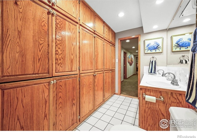 14531 Country Hills Dr, Brighton, CO 80601 - bathroom with tile patterned floors, toilet, recessed lighting, and vanity