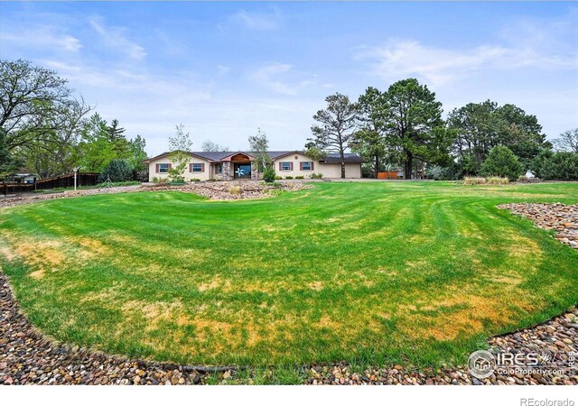 14531 Country Hills Dr, Brighton, CO 80601 - view of front of property featuring a front lawn