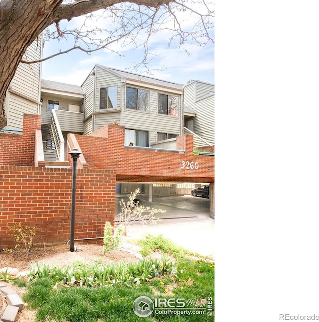 3260 47th St Unit 207A, Boulder, CO 80301 - view of side of home with brick siding