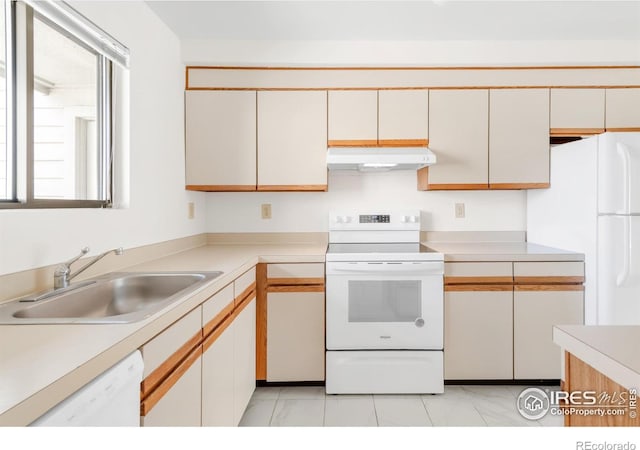 3260 47th St Unit 207A, Boulder, CO 80301 - kitchen featuring white appliances, under cabinet range hood, a sink, light countertops, and light tile patterned flooring