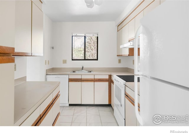 3260 47th St Unit 207A, Boulder, CO 80301 - kitchen with white appliances, a sink, light countertops, under cabinet range hood, and white cabinets