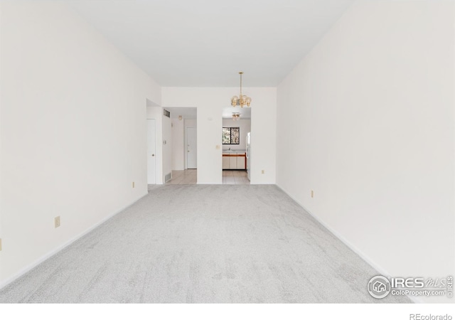 3260 47th St Unit 207A, Boulder, CO 80301 - carpeted empty room with a chandelier and baseboards