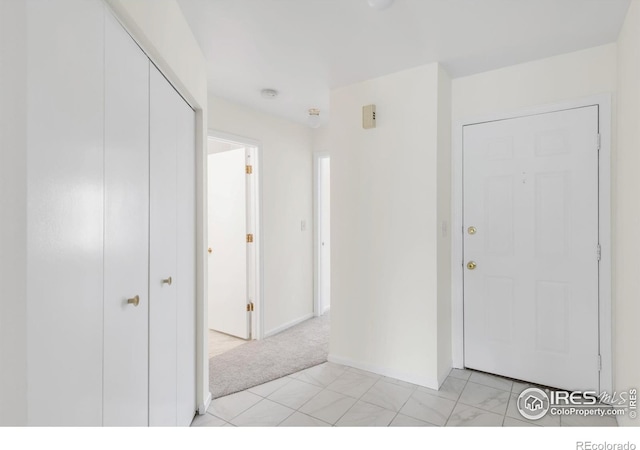3260 47th St Unit 207A, Boulder, CO 80301 - foyer entrance with baseboards and light colored carpet