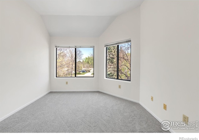 3260 47th St Unit 207A, Boulder, CO 80301 - carpeted spare room with vaulted ceiling and baseboards