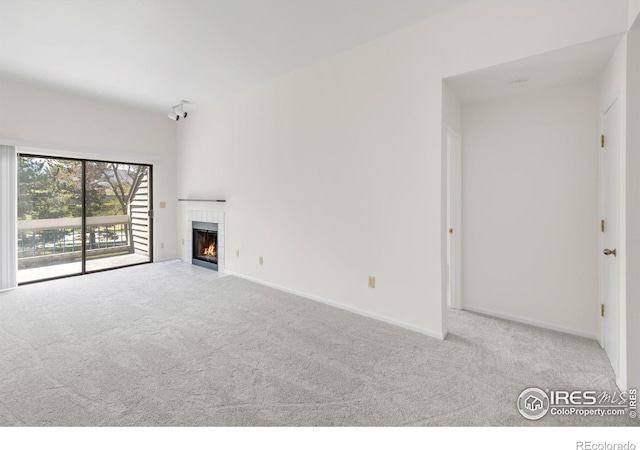 3260 47th St Unit 207A, Boulder, CO 80301 - unfurnished living room with carpet, a fireplace, and baseboards