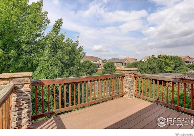 wooden deck with a residential view