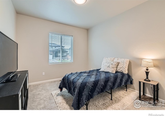 carpeted bedroom with baseboards
