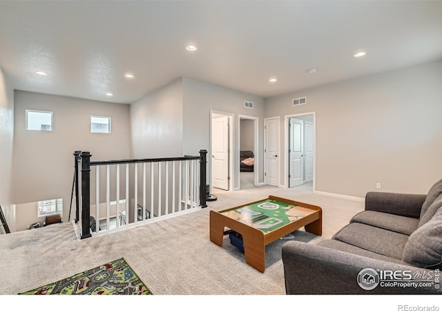 living area with carpet floors, recessed lighting, and baseboards