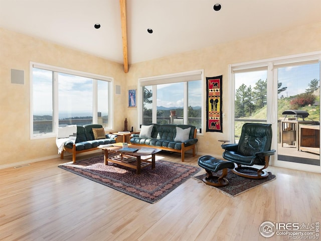 living room with wood finished floors and baseboards