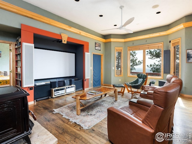 cinema featuring hardwood / wood-style flooring, a ceiling fan, baseboards, and recessed lighting
