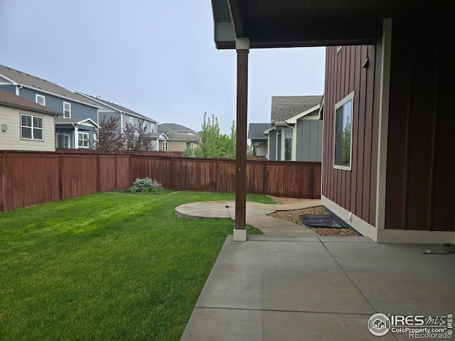 view of yard with a patio area and a residential view