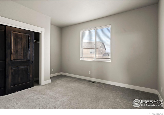 1940 Rolling Wind Dr, Windsor, CO 80550 - unfurnished bedroom featuring carpet floors and baseboards