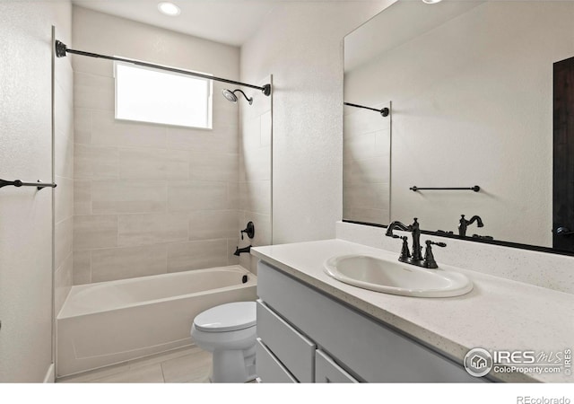 1940 Rolling Wind Dr, Windsor, CO 80550 - bathroom featuring toilet, vanity, tile patterned flooring, and bathing tub / shower combination