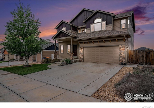 6725 2nd St, Frederick, CO 80530 - craftsman house with fence, board and batten siding, a garage, driveway, and stone siding