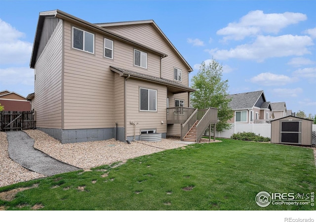 6725 2nd St, Frederick, CO 80530 - rear view of property featuring a storage unit, an outbuilding, stairs, a wooden deck, and a gate
