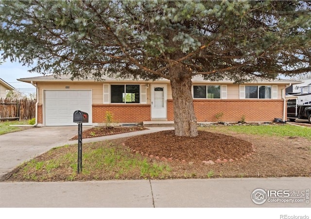 3020 Sunset Dr, Evans, CO 80620 - ranch-style home featuring brick siding, driveway, and an attached garage