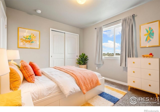 bedroom featuring baseboards, a closet, and carpet floors
