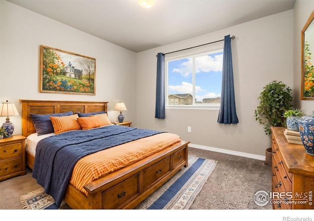 bedroom with carpet and baseboards