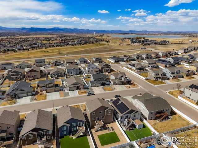 aerial perspective of suburban area with a water and mountain view