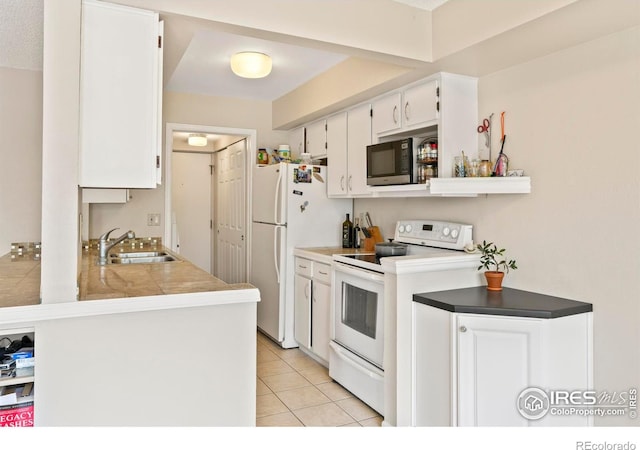 4160 Monroe Dr Unit B, Boulder, CO 80303 - kitchen with white appliances, a sink, white cabinetry, and light tile patterned floors