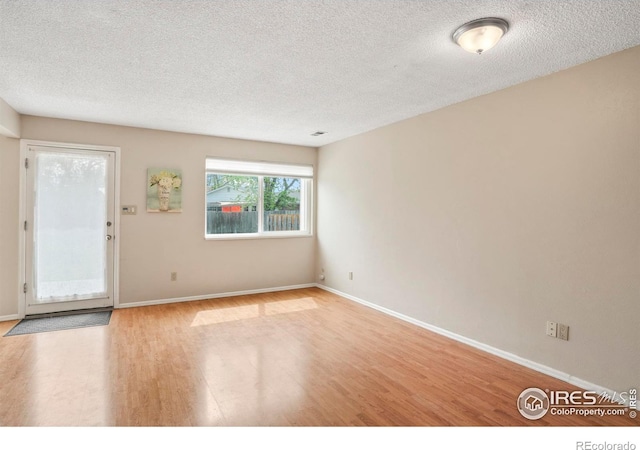 4160 Monroe Dr Unit B, Boulder, CO 80303 - spare room featuring wood finished floors, a textured ceiling, and baseboards