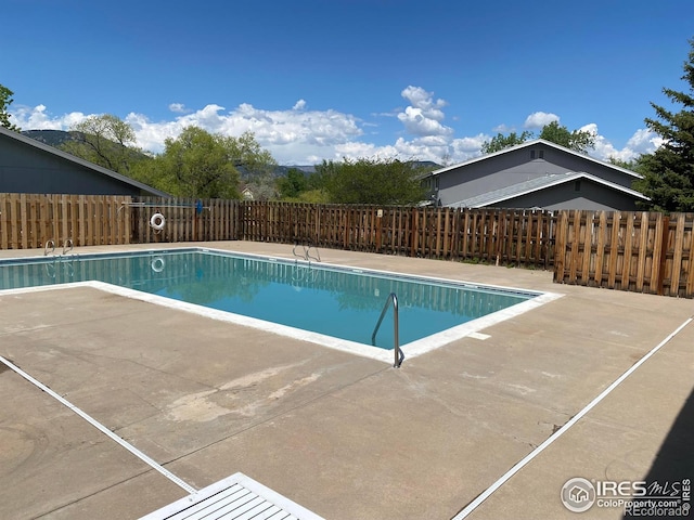 4160 Monroe Dr Unit B, Boulder, CO 80303 - community pool featuring a patio area and a fenced backyard