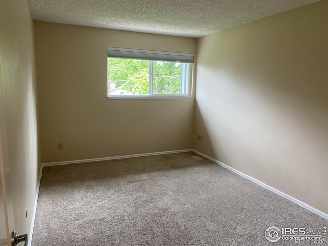 4160 Monroe Dr Unit B, Boulder, CO 80303 - carpeted empty room featuring a textured ceiling and baseboards