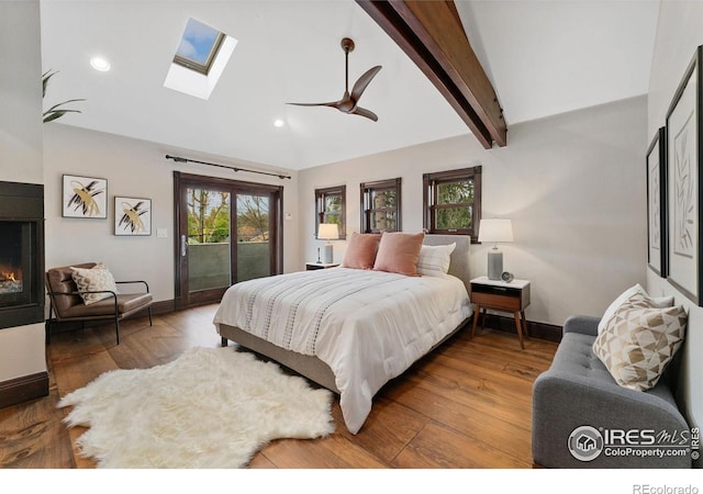 bedroom with access to outside, a skylight, baseboards, recessed lighting, and wood finished floors