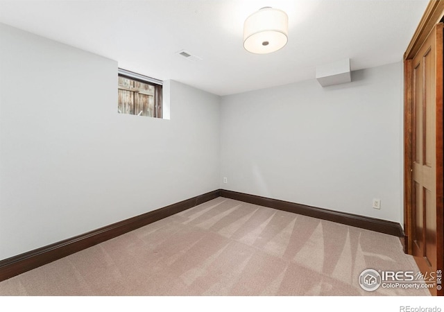 below grade area with carpet flooring and baseboards