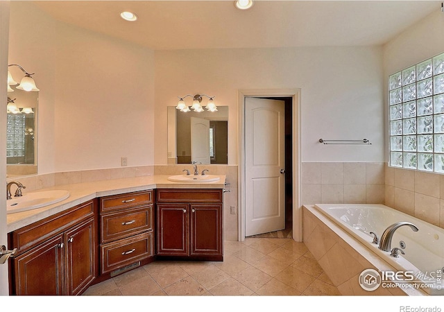 bathroom featuring a bath, tile patterned flooring, double vanity, and recessed lighting