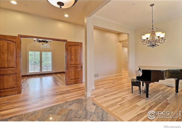 dining area featuring a chandelier, ornamental molding, light wood-style floors, recessed lighting, and baseboards